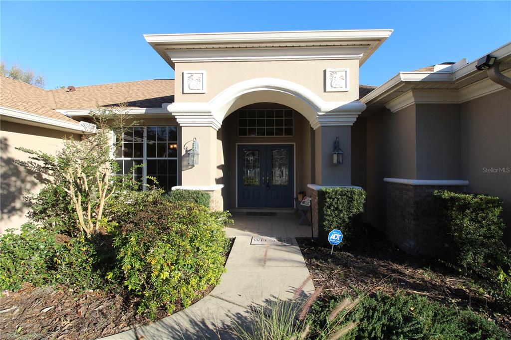 8476 Madrid Road Weeki Wachee, FL 34613 - Photo 12 of 37 a view of entryway with garden