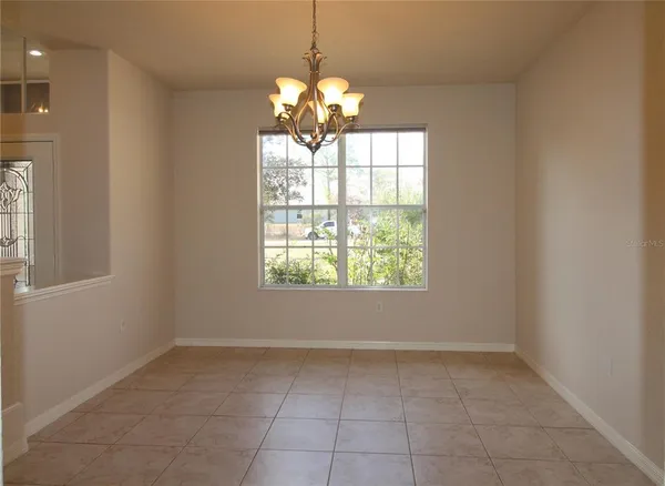 a lobby with furniture and floor to ceiling window