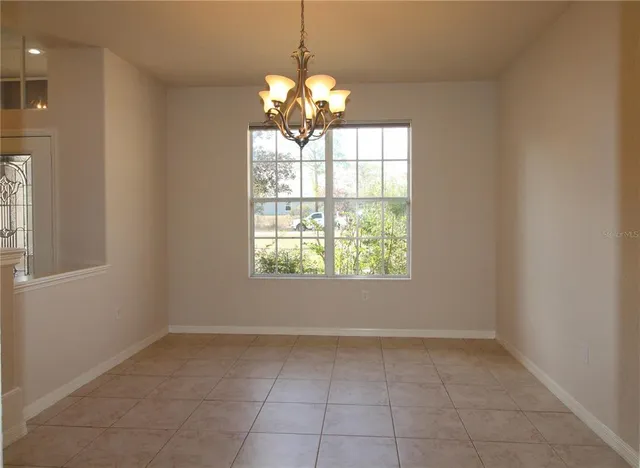 a living room with furniture and flat screen tv