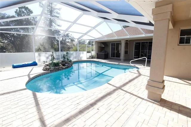 a view of a swimming pool with a sitting space
