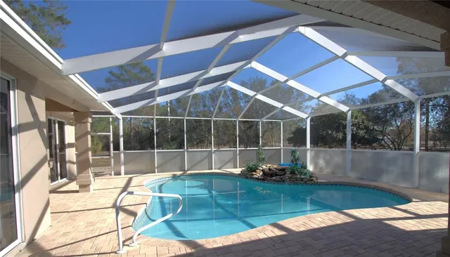 a lobby with furniture and floor to ceiling window