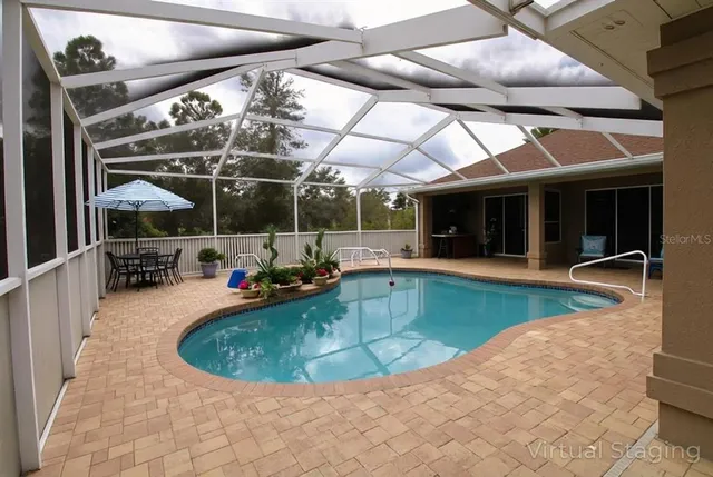 a view of a swimming pool with a patio