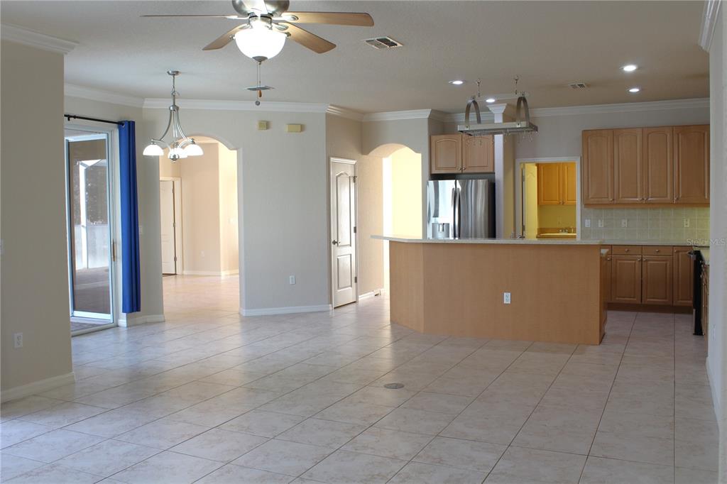 8476 Madrid Road Weeki Wachee, FL 34613 - Photo 33 of 59 a view of a kitchen with a refrigerator and a sink