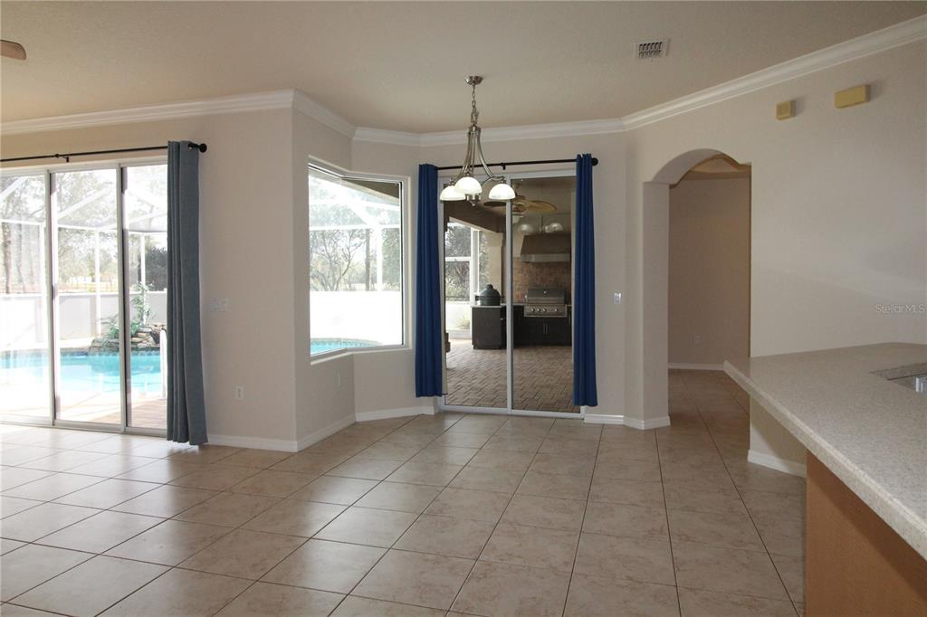 8476 Madrid Road Weeki Wachee, FL 34613 - Photo 6 of 59 a view of an empty room with glass door