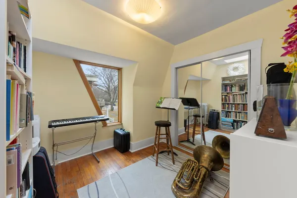 a room with furniture mirror and wooden floor