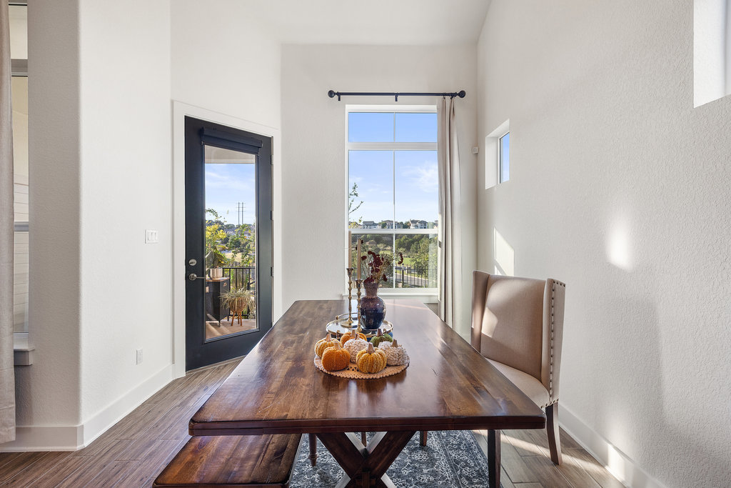 427 Cartwheel Bend, Unit 92 Austin, TX 78738 - Photo 13 of 40 a view of a dining room with furniture window and wooden floor