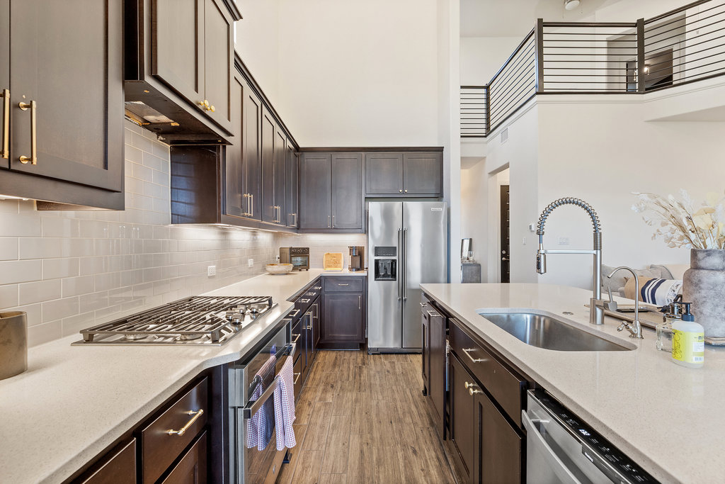 427 Cartwheel Bend, Unit 92 Austin, TX 78738 - Photo 14 of 40 a kitchen with a appliances cabinets and a counter top space