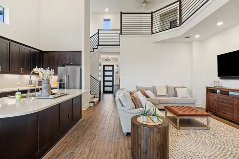 a kitchen with a refrigerator and a stove