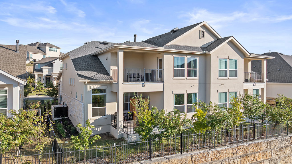 427 Cartwheel Bend, Unit 92 Austin, TX 78738 - Photo 2 of 40 a front view of a house with a yard