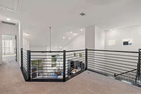 a view of an empty room with a fireplace