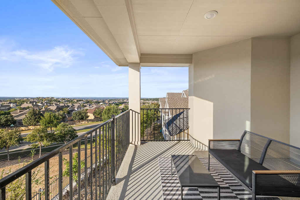 427 Cartwheel Bend, Unit 92 Austin, TX 78738 - Photo 36 of 40 a view of a balcony with wooden floor