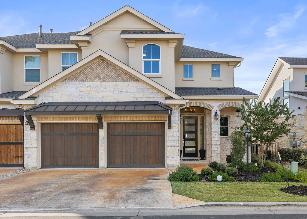 427 Cartwheel Bend, Unit 92 Austin, TX 78738 - Photo 5 of 40 a front view of a house with garden