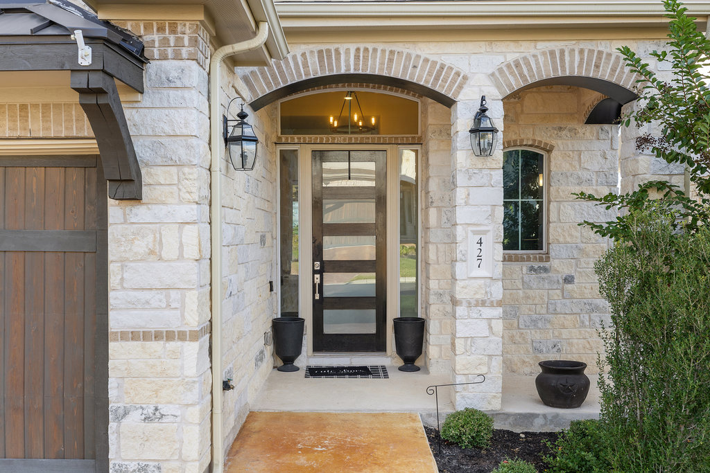 427 Cartwheel Bend, Unit 92 Austin, TX 78738 - Photo 6 of 40 a front view of a house with a balcony