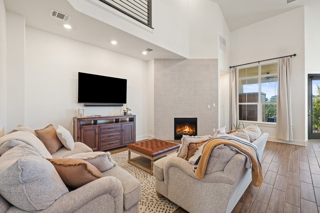 427 Cartwheel Bend, Unit 92 Austin, TX 78738 - Photo 10 of 40 a living room with furniture and a flat screen tv