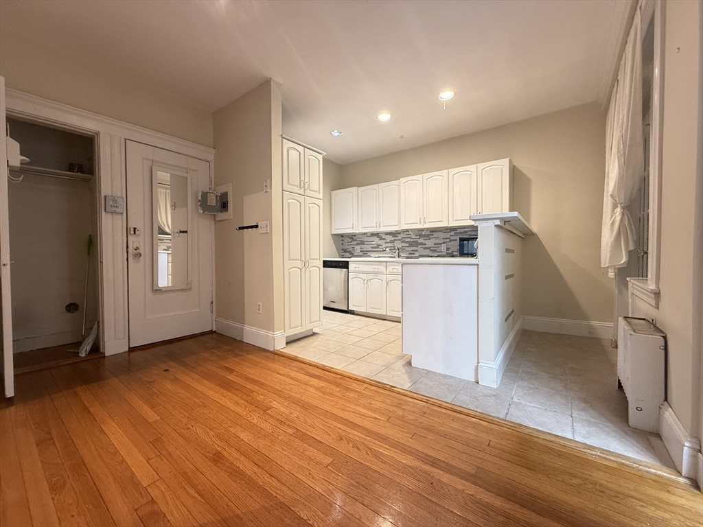 15 Colliston Road, Unit 5 Boston, MA 02135 - Photo 1 of 9 a view of a kitchen with a sink and a refrigerator