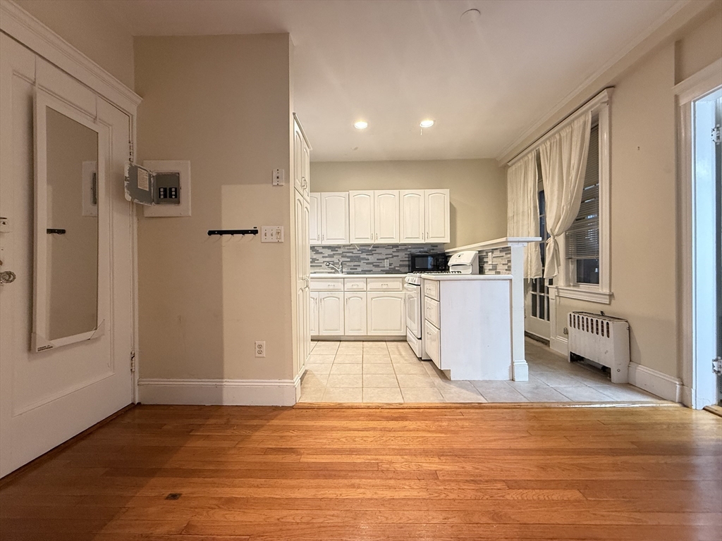 15 Colliston Road, Unit 5 Boston, MA 02135 - Photo 3 of 9 a view of a kitchen with wooden floor
