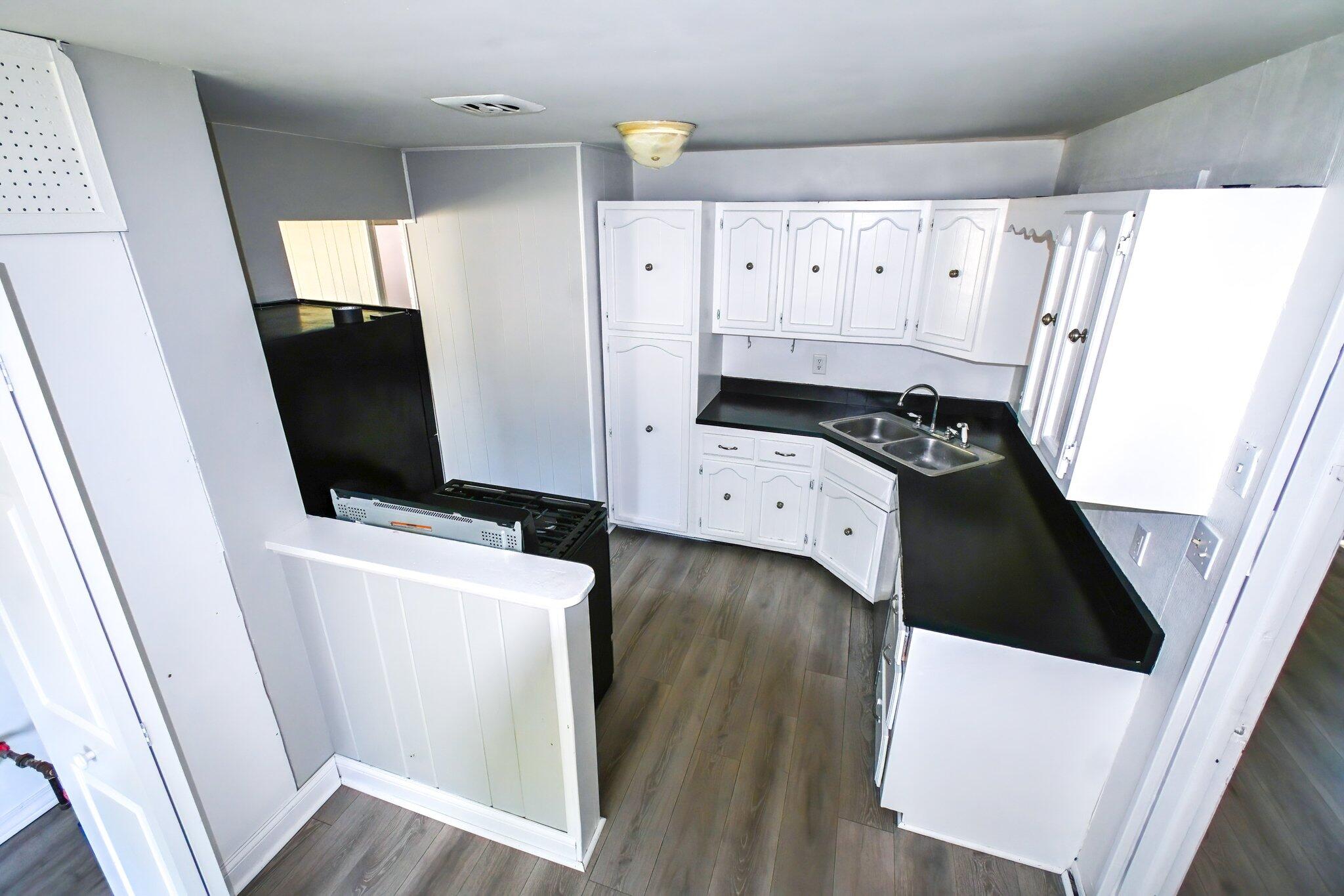 7828 Chestnut Avenue Hammond, IN 46324 - Photo 6 of 23 a view of washer and dryer with wooden floor