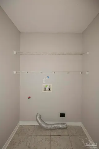 an empty room with windows and outdoor view