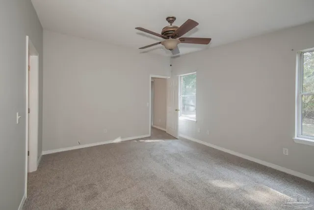 a bathroom with a tub a sink and a large mirror