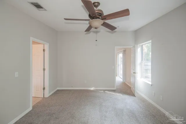 a spacious bathroom with a bathtub sink and mirror