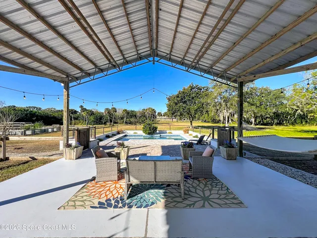 a view of a swimming pool with a patio