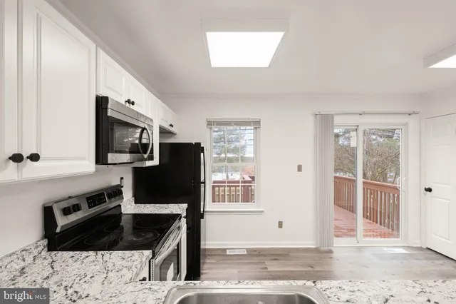 a view of balcony with furniture