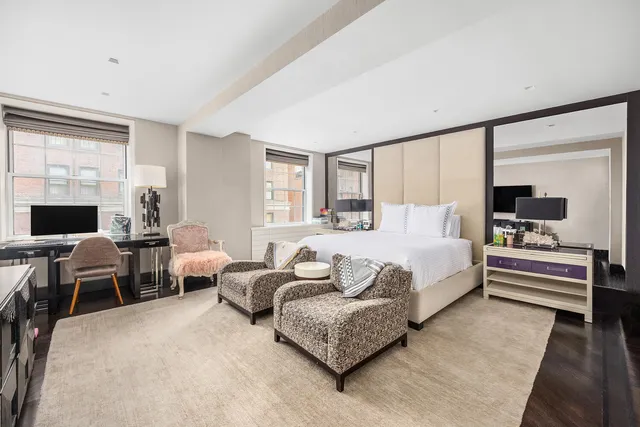 a bed room with bed and a large window