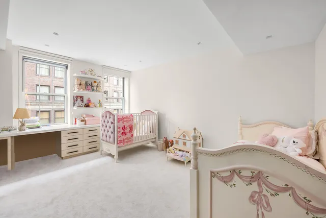 a bedroom with a bed and a cabinets