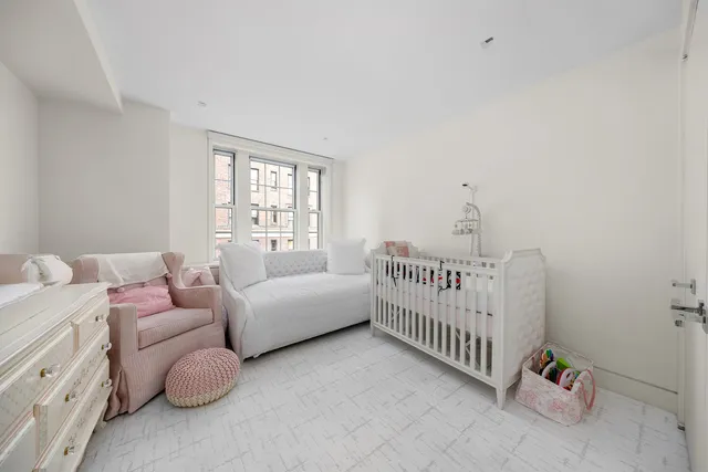 a bed room with furniture and a window