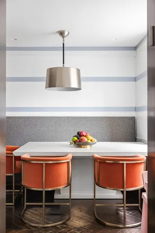 a room with a table and chairs