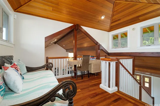 a view of a livingroom with furniture and staircase
