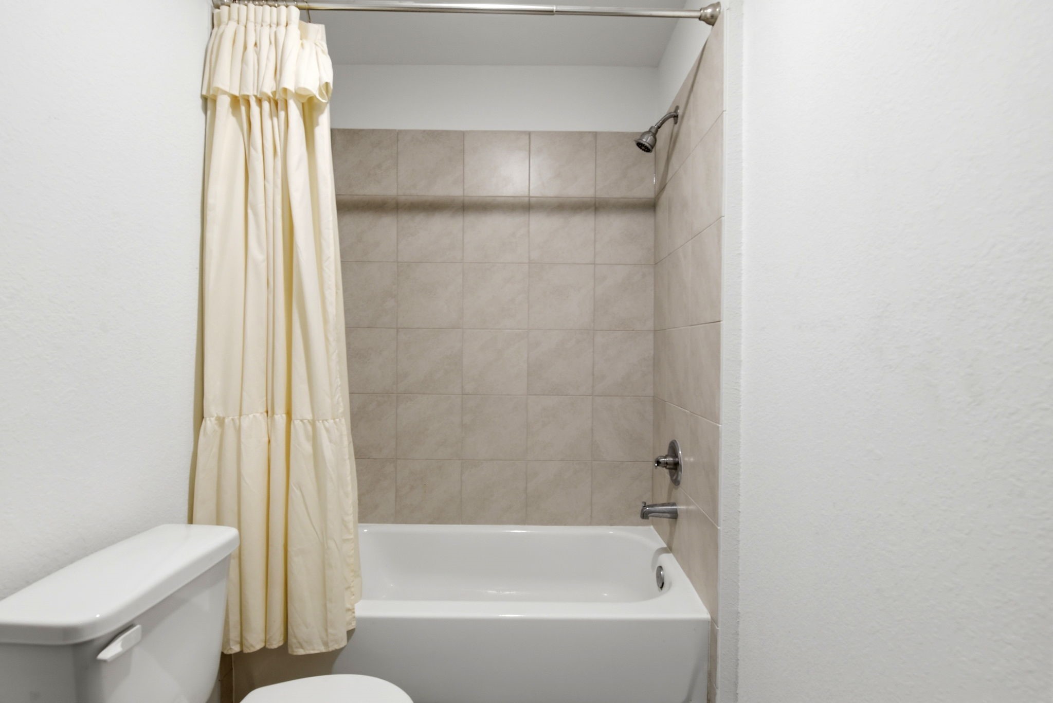 9819 Emerald Stone Way Conroe, TX 77306 - Photo 29 of 38 a bathroom with a shower and a toilet