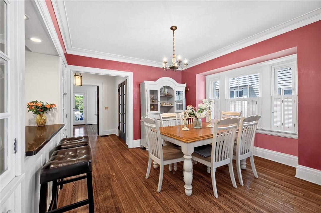 138 Dorchester Road Rochester, NY 14610 - Photo 21 of 41 The elegant formal Dining Room presents hard wood floors, center chandelier, wide moldings and a wall of windows!