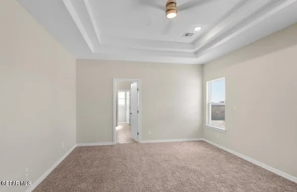 an empty room with a empty space and windows