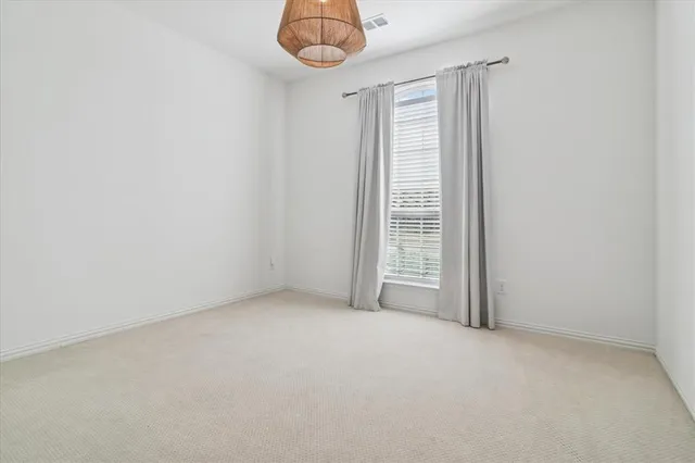 a view of a patio with table and chairs and wooden floor