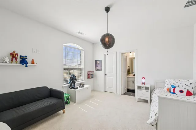 a view of a livingroom with a ceiling fan and window