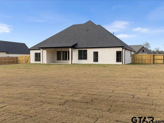 a front view of a house with yard