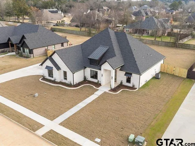 an aerial view of a house with swimming pool