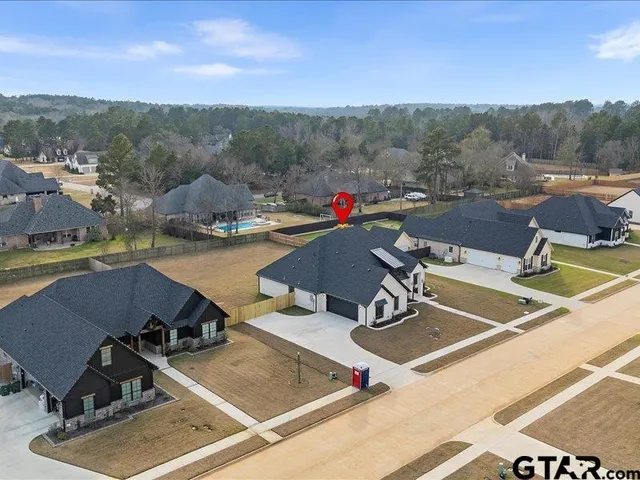 a view of a swimming pool with mountains in the background