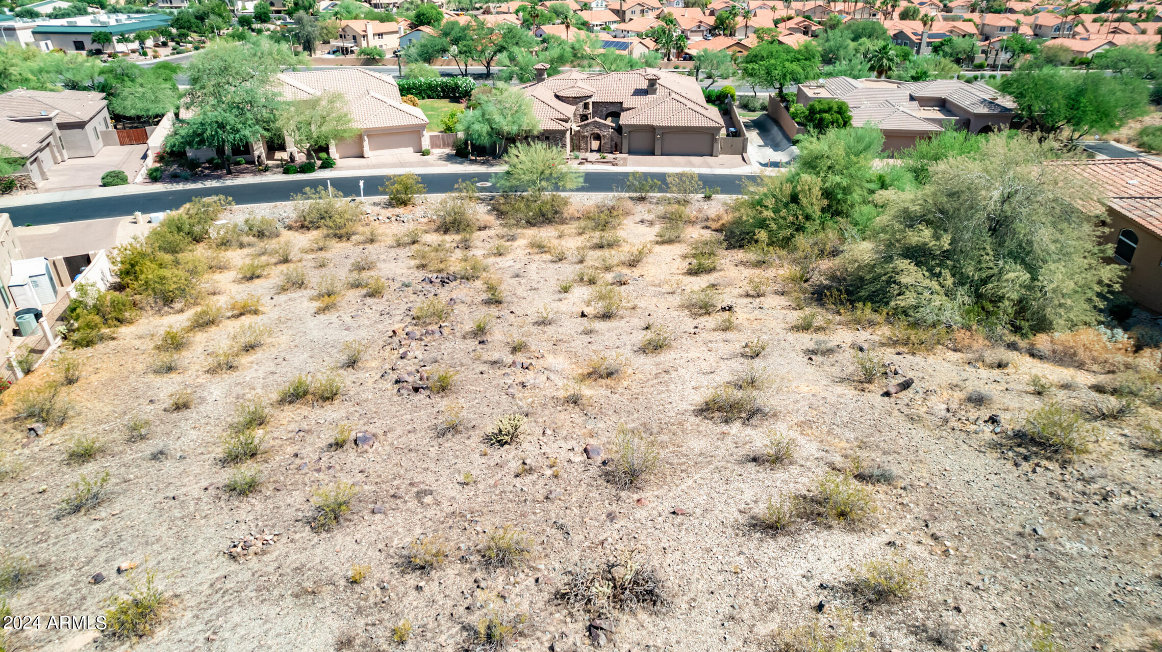 2115 East Barkwood Road, Unit 23 Phoenix, AZ 85048 - Photo 2 of 15 a view of a backyard with plants and lake view