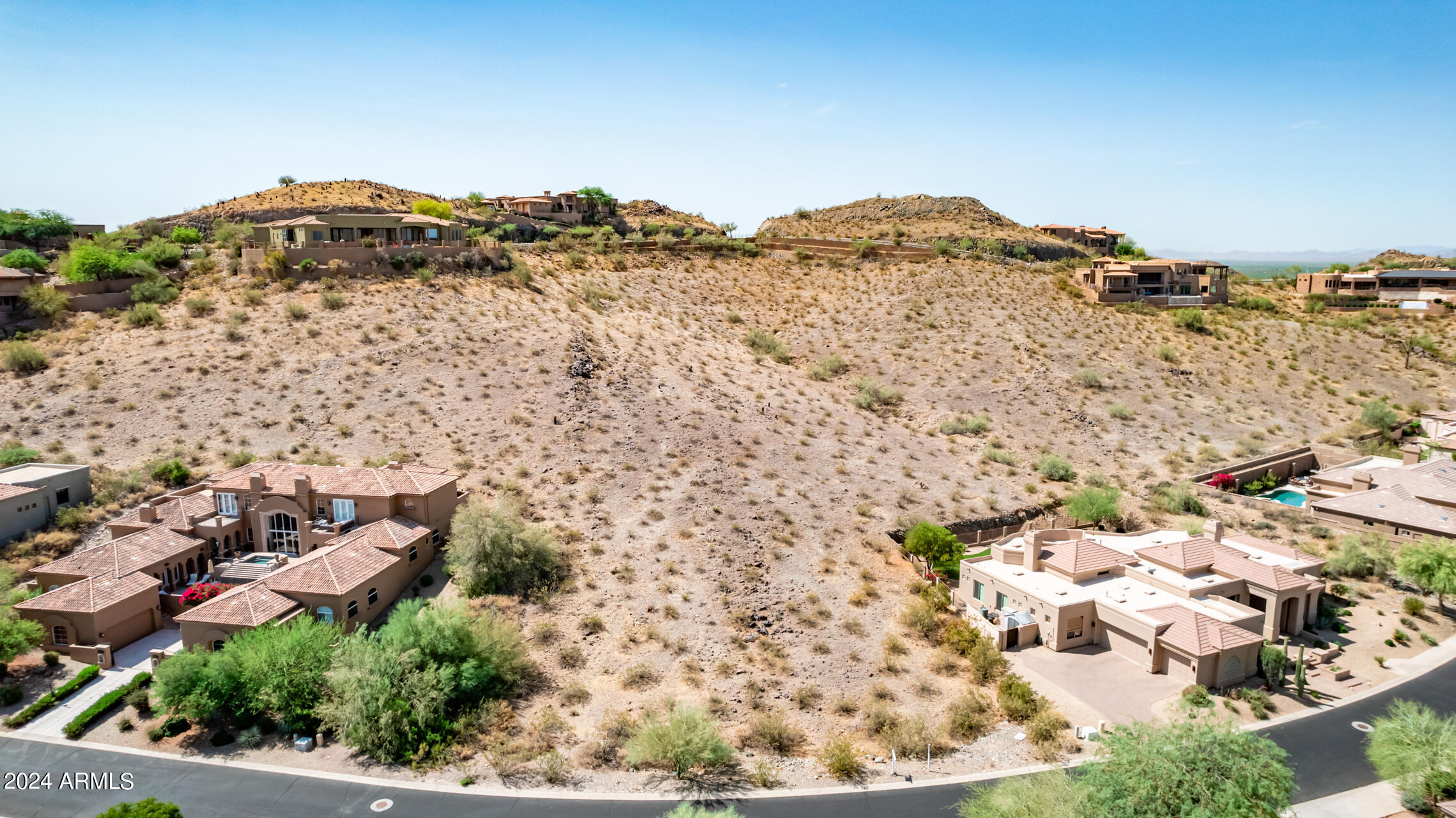 2115 East Barkwood Road, Unit 23 Phoenix, AZ 85048 - Photo 7 of 15 a view of a large building with a mountain in the background
