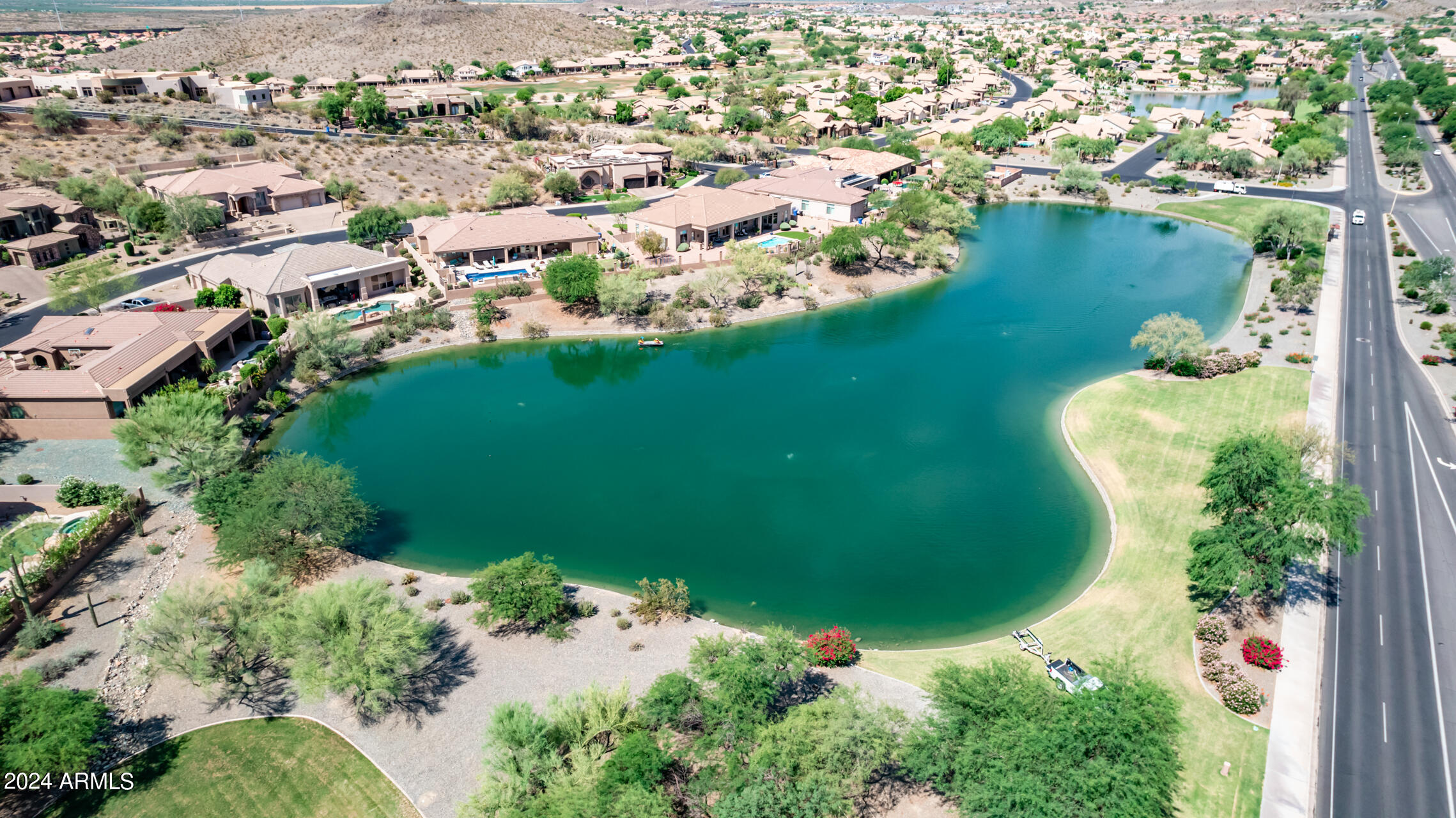 2115 East Barkwood Road, Unit 23 Phoenix, AZ 85048 - Photo 9 of 15 an aerial view of a house with a yard and lake view