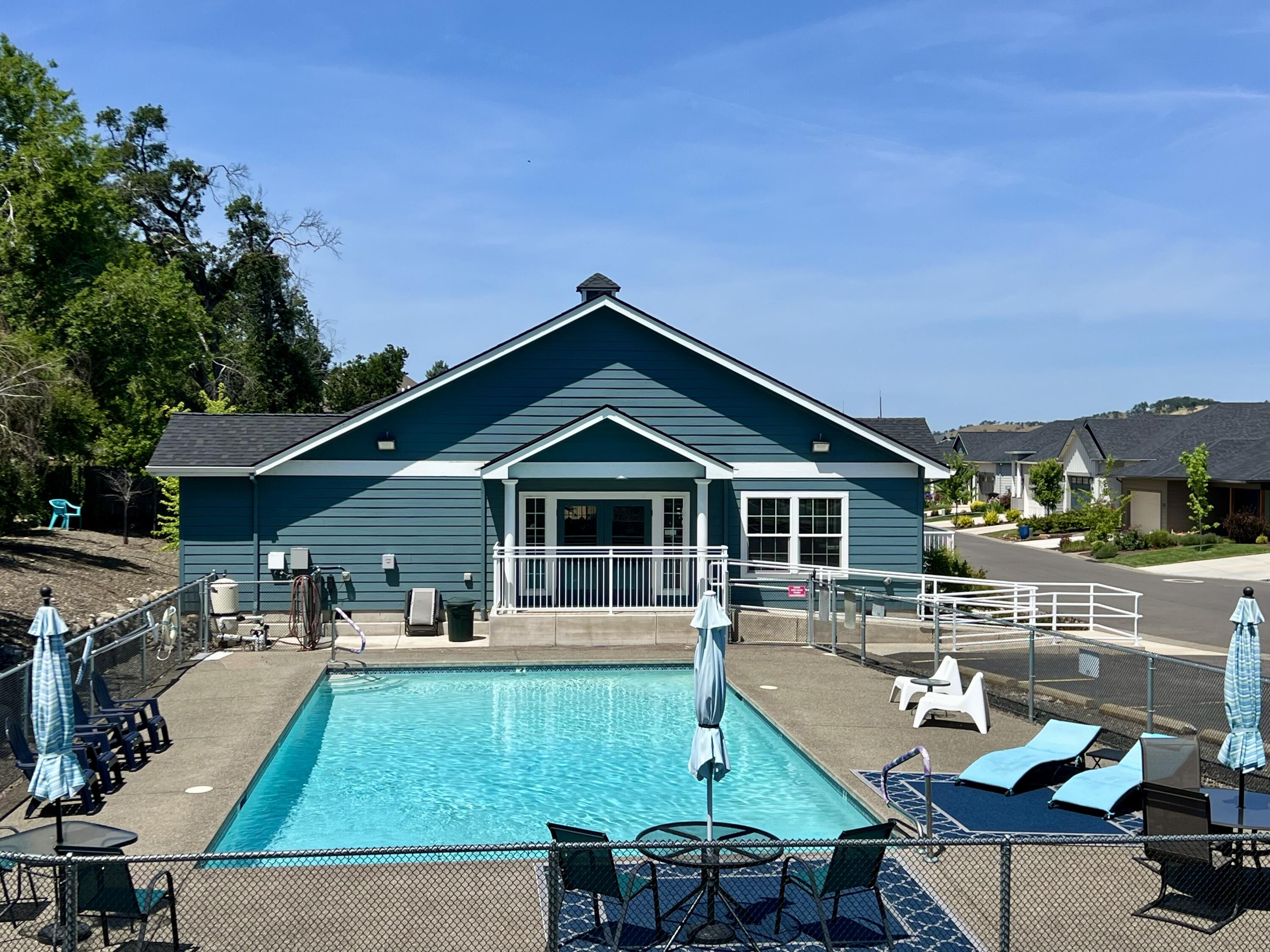 248 Christopher Way Talent, OR 97540 - Photo 33 of 33 a view of a house with pool and chairs