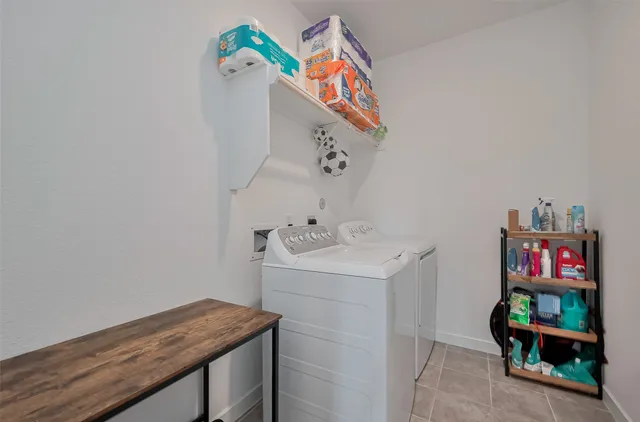 a bathroom with a sink a vanity and painting