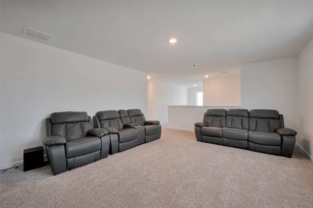 a living room with furniture and a couch