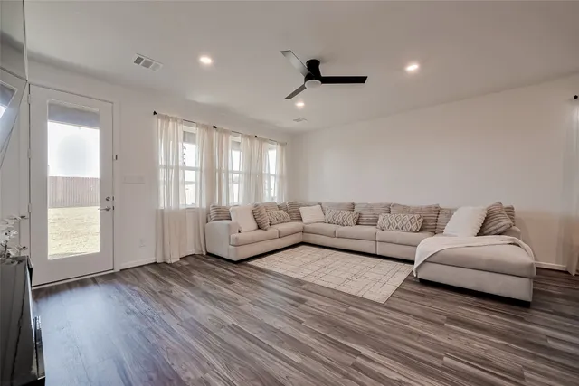 a living room with furniture and a window
