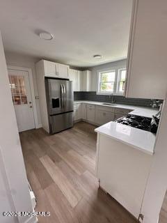 1721 River Road Belmar, NJ 07719 - Photo 12 of 14 a kitchen with a stove and a microwave