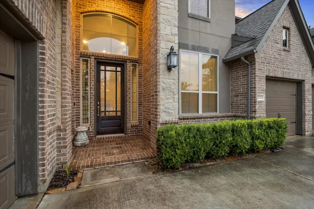 a view of a brick house with a large windows
