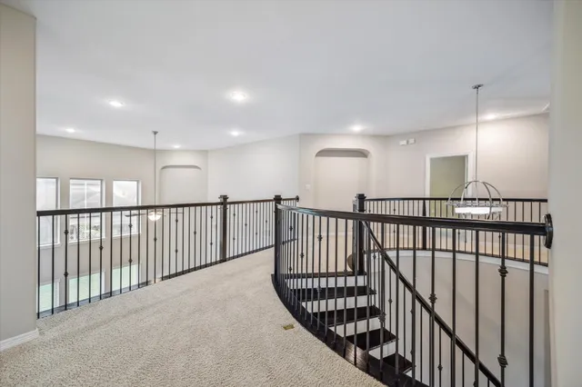 a view of staircase with wooden floor