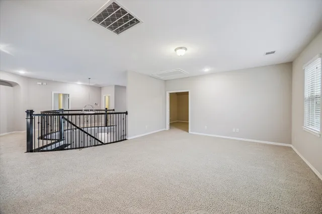 a view of an empty room and windows